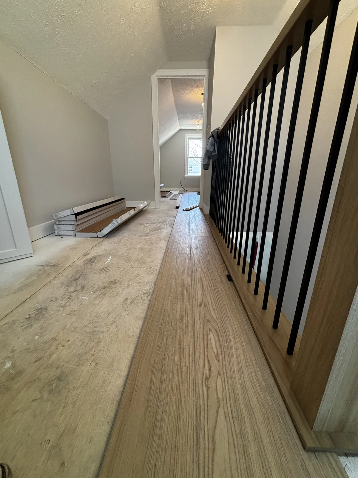 LVP flooring installation along railing